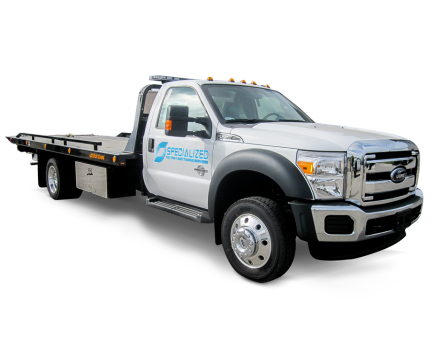 White Ford flatbed tow truck with single cab, chrome grille, SPECIALIZED logo on door and amber roof lights.