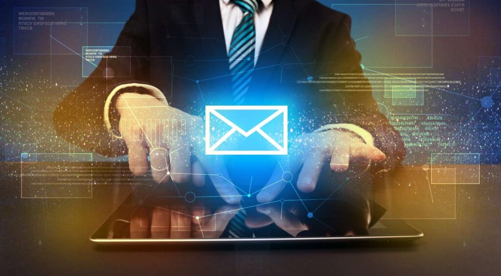 A suited businessperson tapping a tablet with a glowing envelope icon and interconnected digital network graphics.
